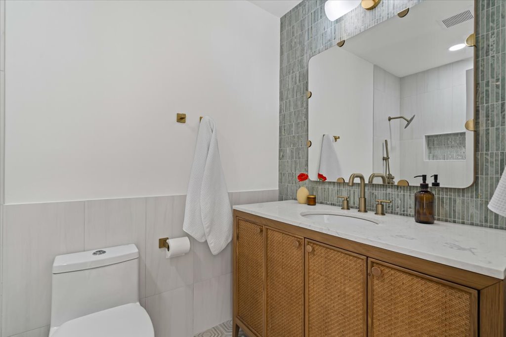 2014 Hardy Circle Austin, TX 78757 - Photo 24 of 34 a bathroom with a sink toilet and mirror