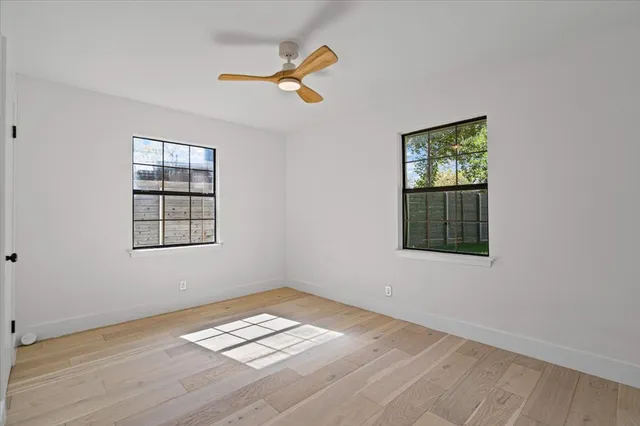 a view of empty room with windows