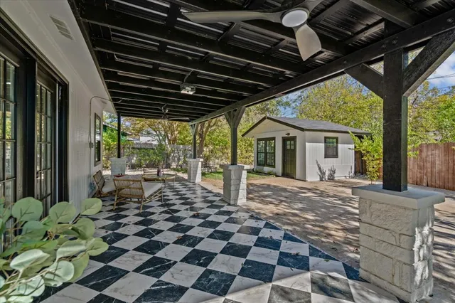 a view of a porch with chairs and floor