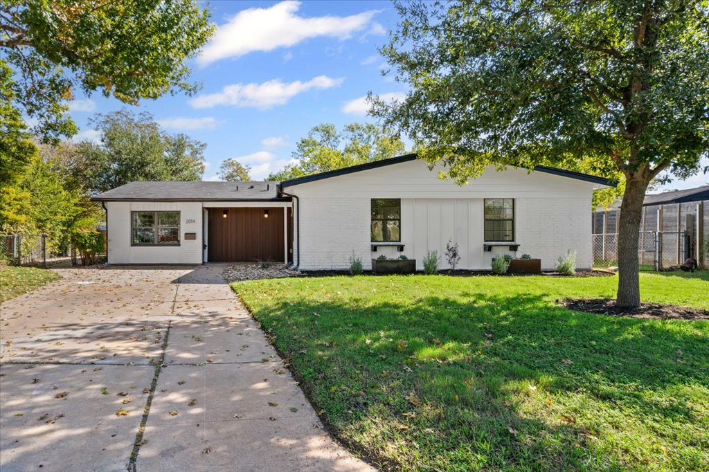 2014 Hardy Circle Austin, TX 78757 - Photo 3 of 34 a view of a house with backyard and a tree