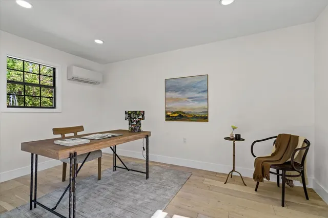 a view of a workspace with furniture