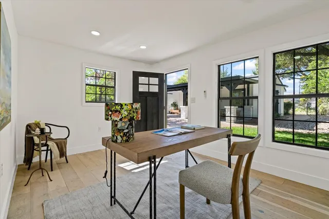 a view of a dining room with furniture window and outside view