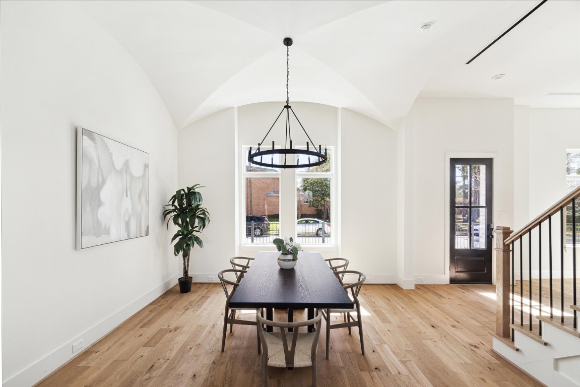 5307 Lambeth Riverside Drive Houston, TX 77091 - Photo 5 of 30 a view of a dining room with furniture window and wooden floor