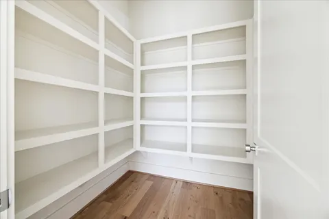 a view of a room with a wooden floor