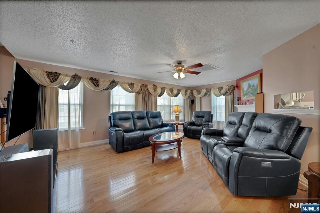 72 Marrow Street, Unit 3101 Newark, NJ 07103 - Photo 6 of 20 a living room with furniture and a large window