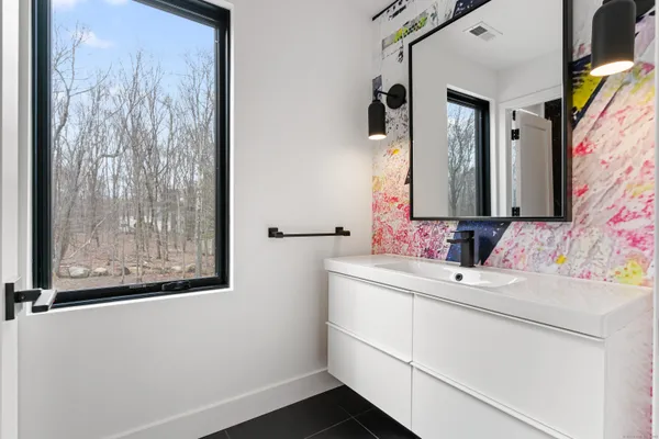 a bathroom with a sink and a mirror