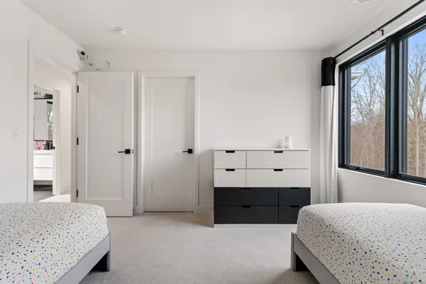 a bedroom with a bed and a dresser