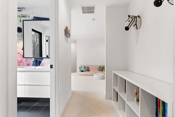 a room with pool table and windows