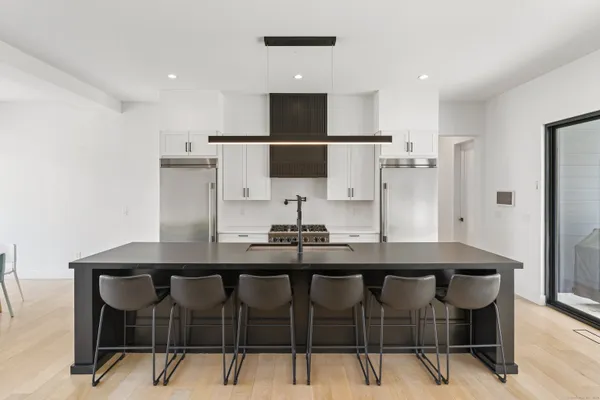 a kitchen with a table and chairs in it