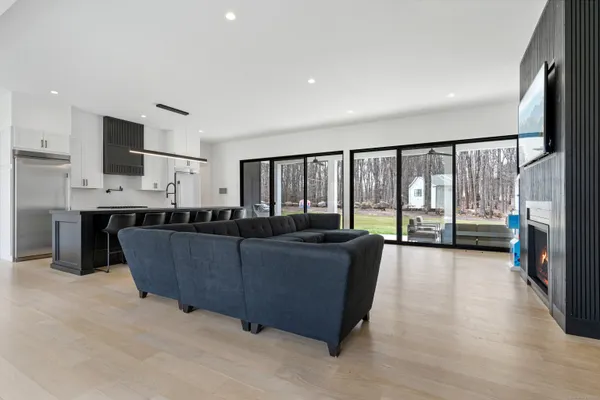 a living room with furniture and a large window