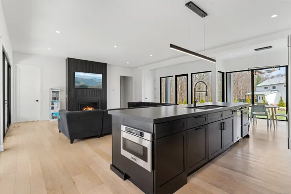 a kitchen with stainless steel appliances granite countertop a stove and a sink