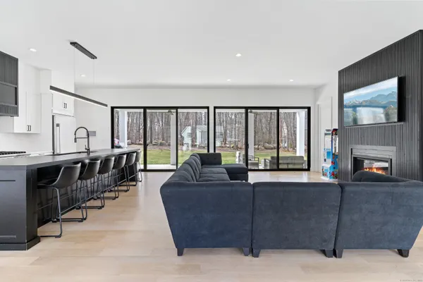 a living room with furniture and a large window