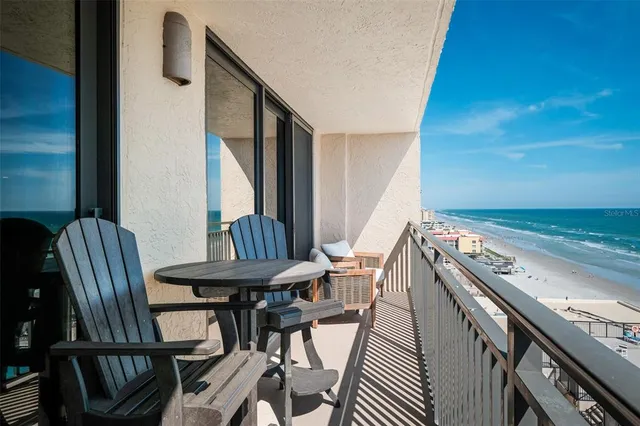a view of a balcony with chairs