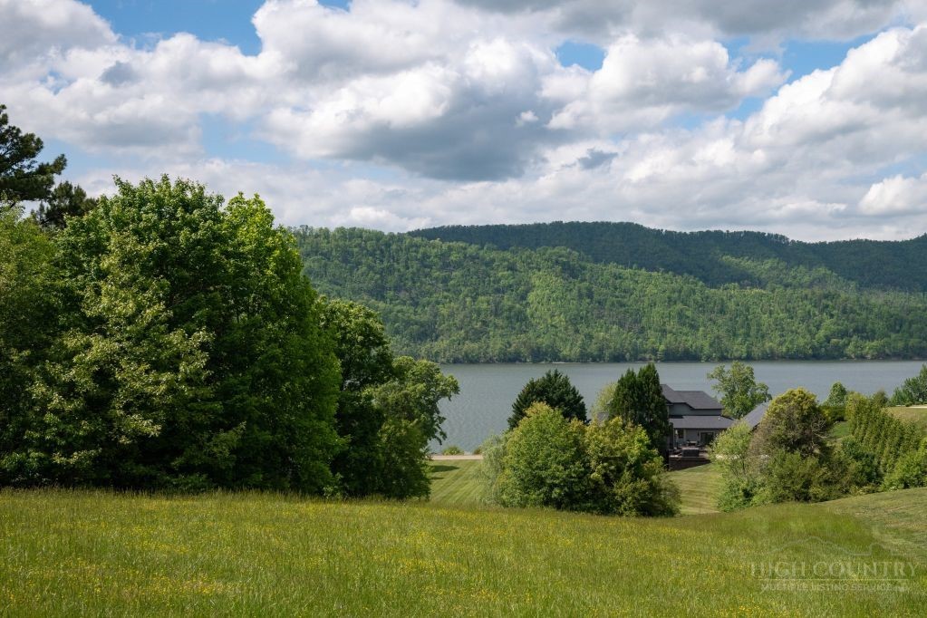 Lot 84 Harbor View Butler, TN 37640 - Photo 23 of 32 a view of a lake with a mountain in the background