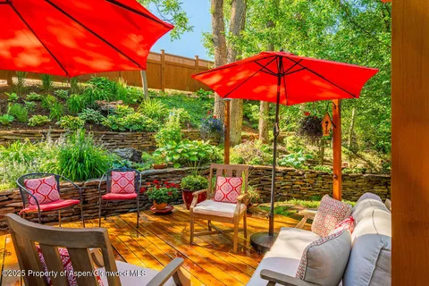 a view of a chairs and table in the patio