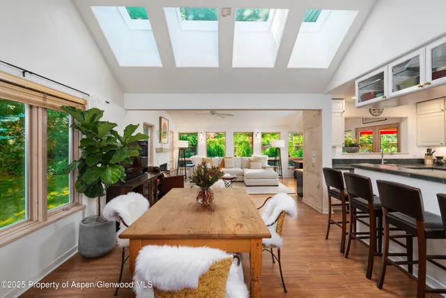 a view of a dining room with furniture window and outside view