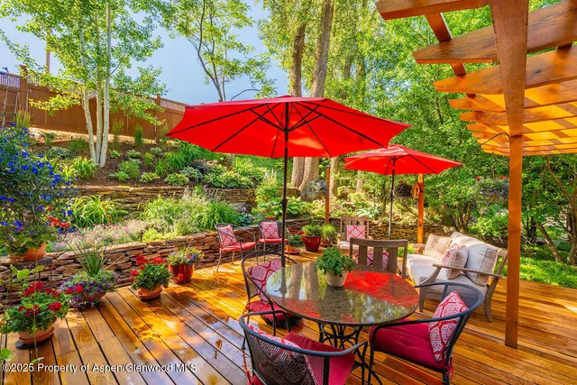 a spacious bedroom with a bed and a potted plant