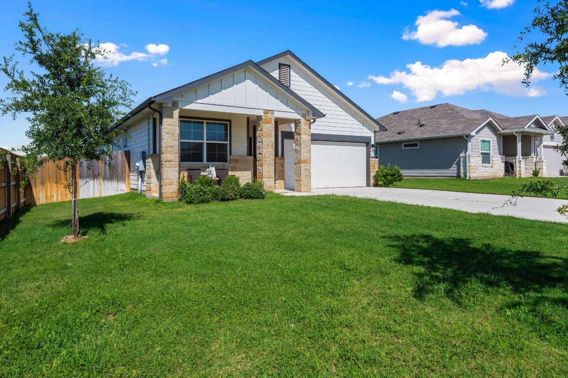 208 Bunting Lane Bertram, TX 78605 - Photo 1 of 1 a front view of a house with a yard