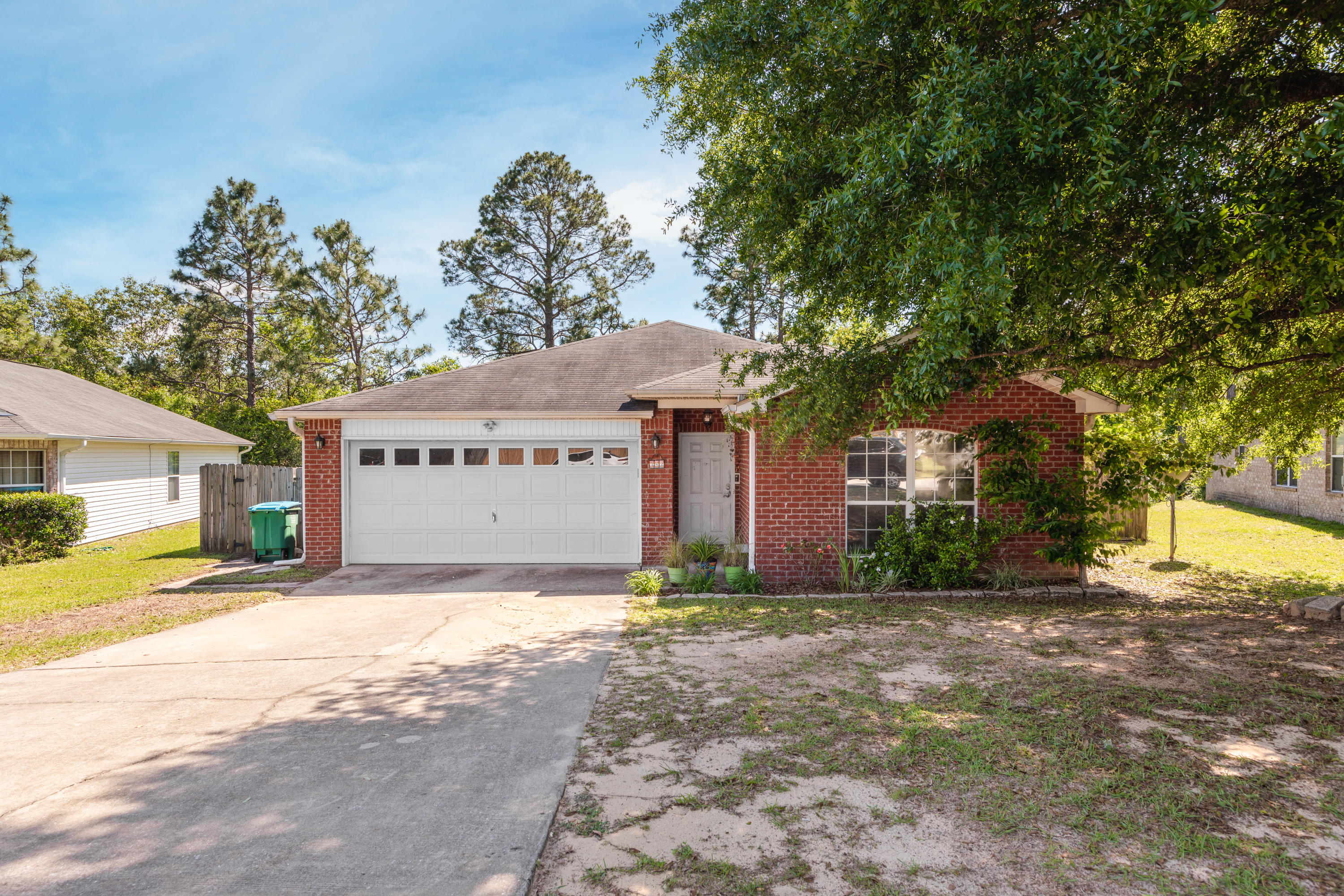 262 Limestone Circle Crestview, FL 32539 - Photo 1 of 21 a front view of a house with a yard and garage