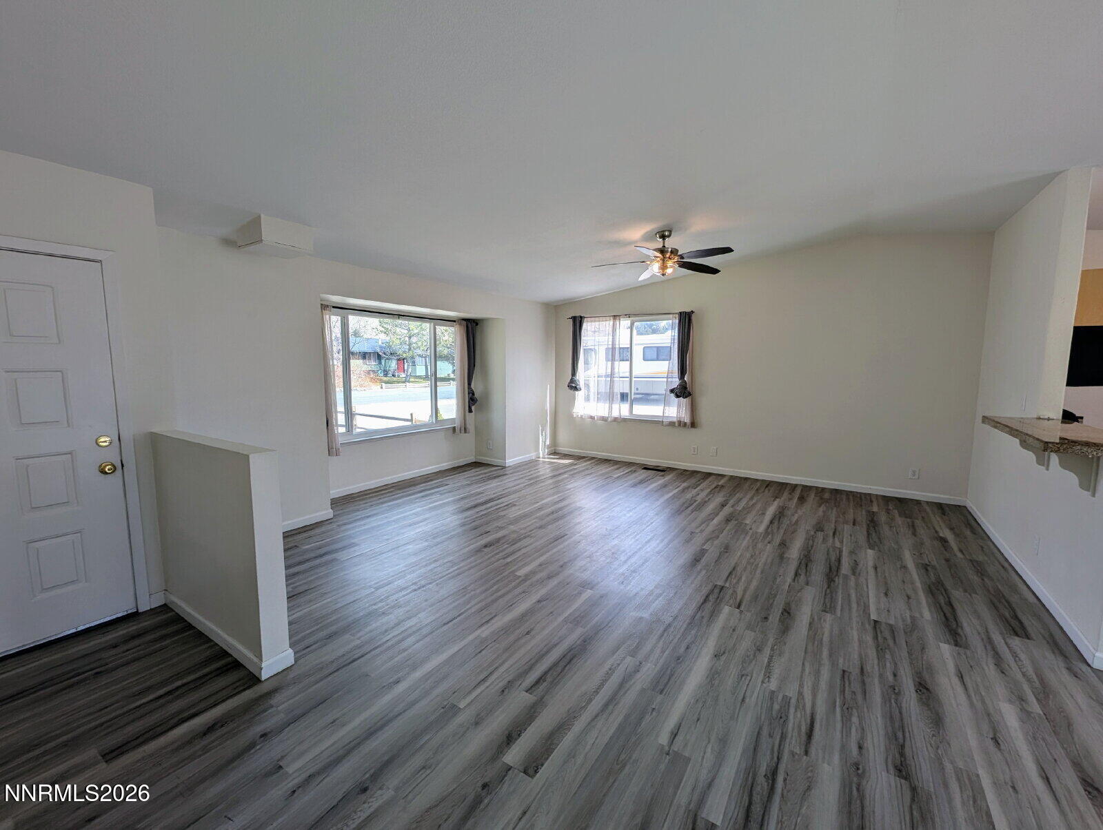 3440 Canvasback Lane Reno, NV 89508 - Photo 11 of 45 wooden floor in an empty room with a window