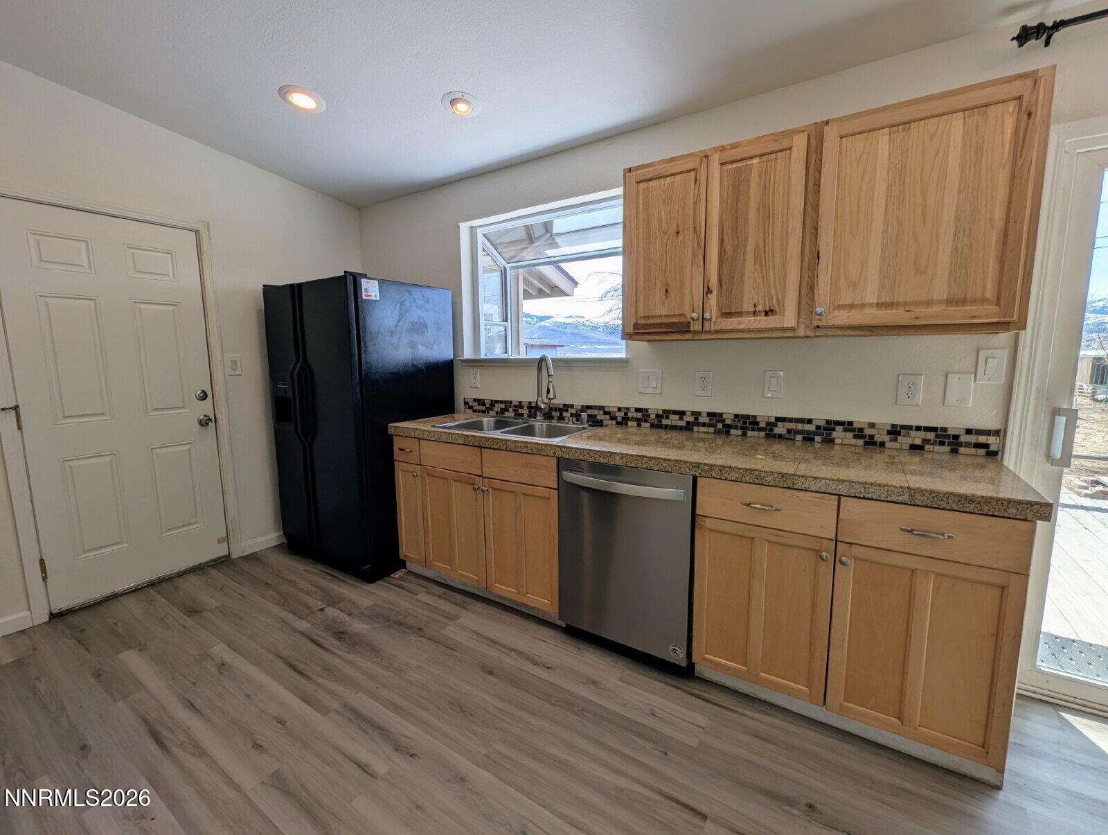 3440 Canvasback Lane Reno, NV 89508 - Photo 13 of 45 a kitchen with stainless steel appliances granite countertop a stove a sink and a refrigerator