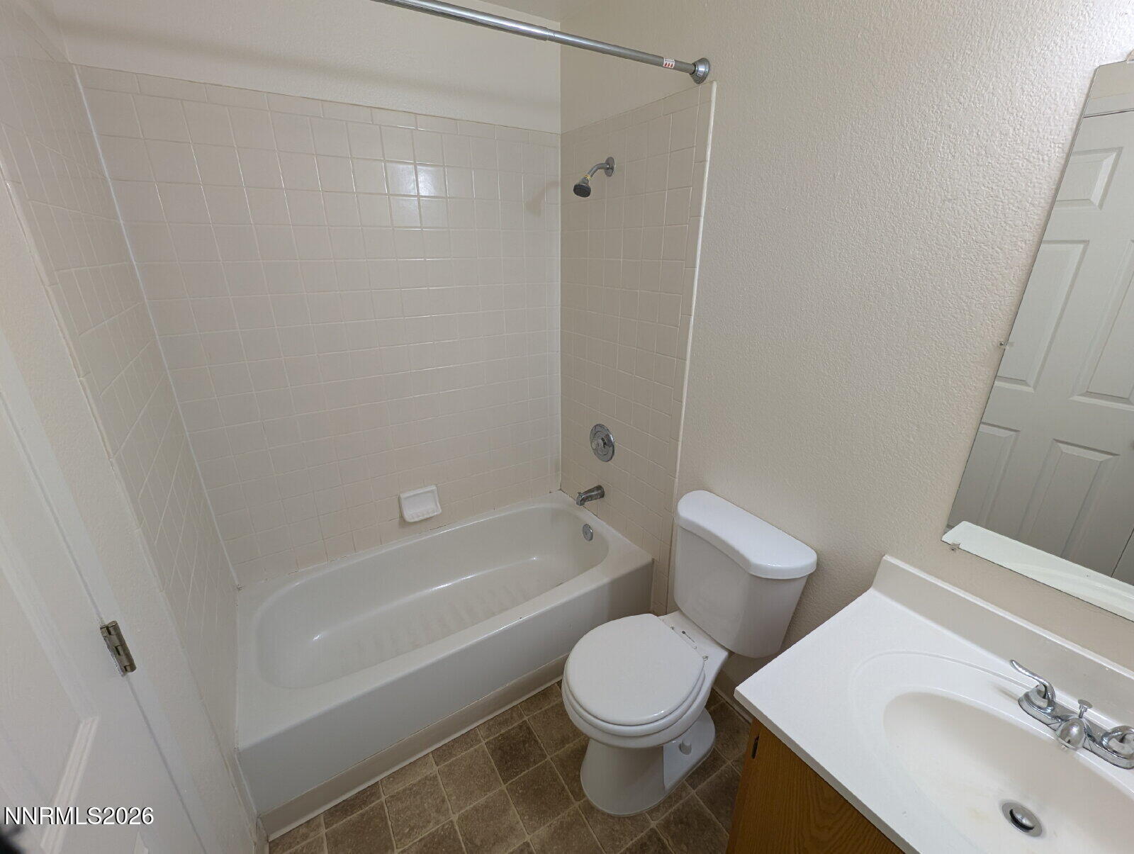 3440 Canvasback Lane Reno, NV 89508 - Photo 16 of 45 a white toilet sitting next to a bath tub
