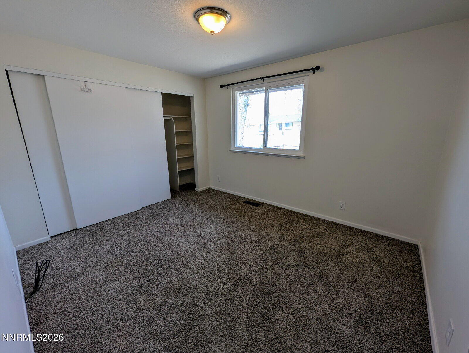 3440 Canvasback Lane Reno, NV 89508 - Photo 21 of 45 a view of an empty room with a window