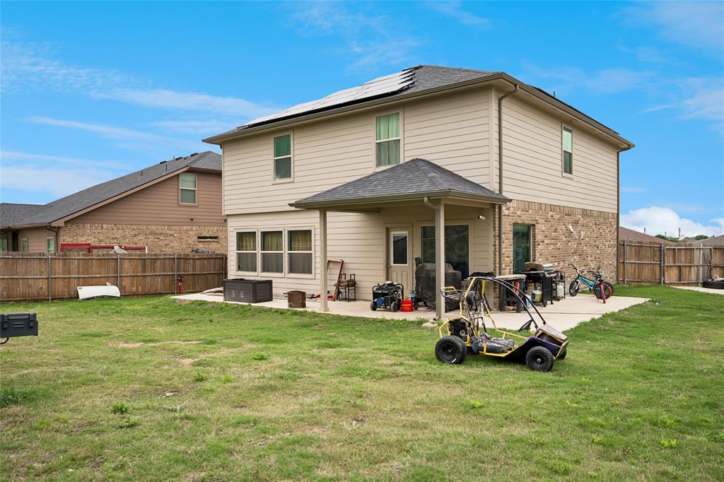 324 Fairgrounds Lane Ponder, TX 76259 - Photo 23 of 40 a view of a house with a yard and deck