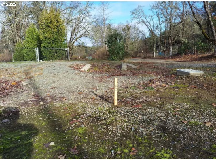 1490 Golf Club Drive Cave Junction, OR 97523 - Photo 1 of 2 a backyard of a house with lots of green space