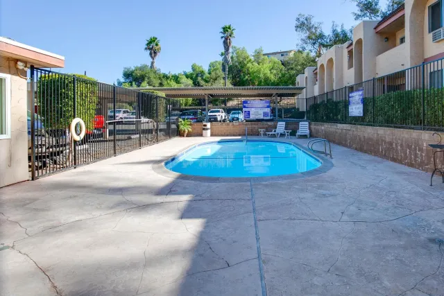 a view of a swimming pool with sitting area
