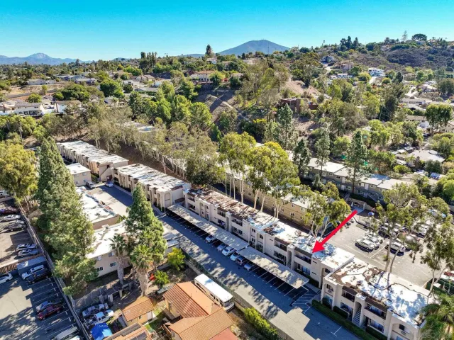 an aerial view of residential houses with outdoor space