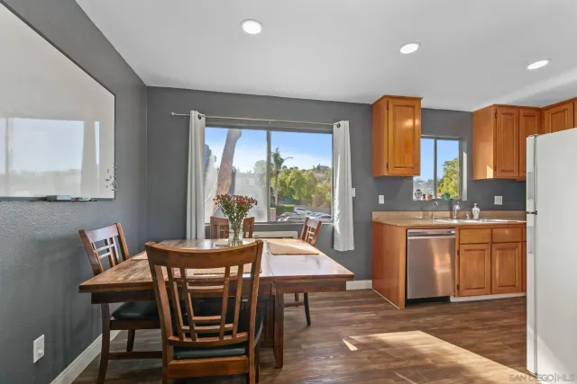 a view of a dining room with furniture and window