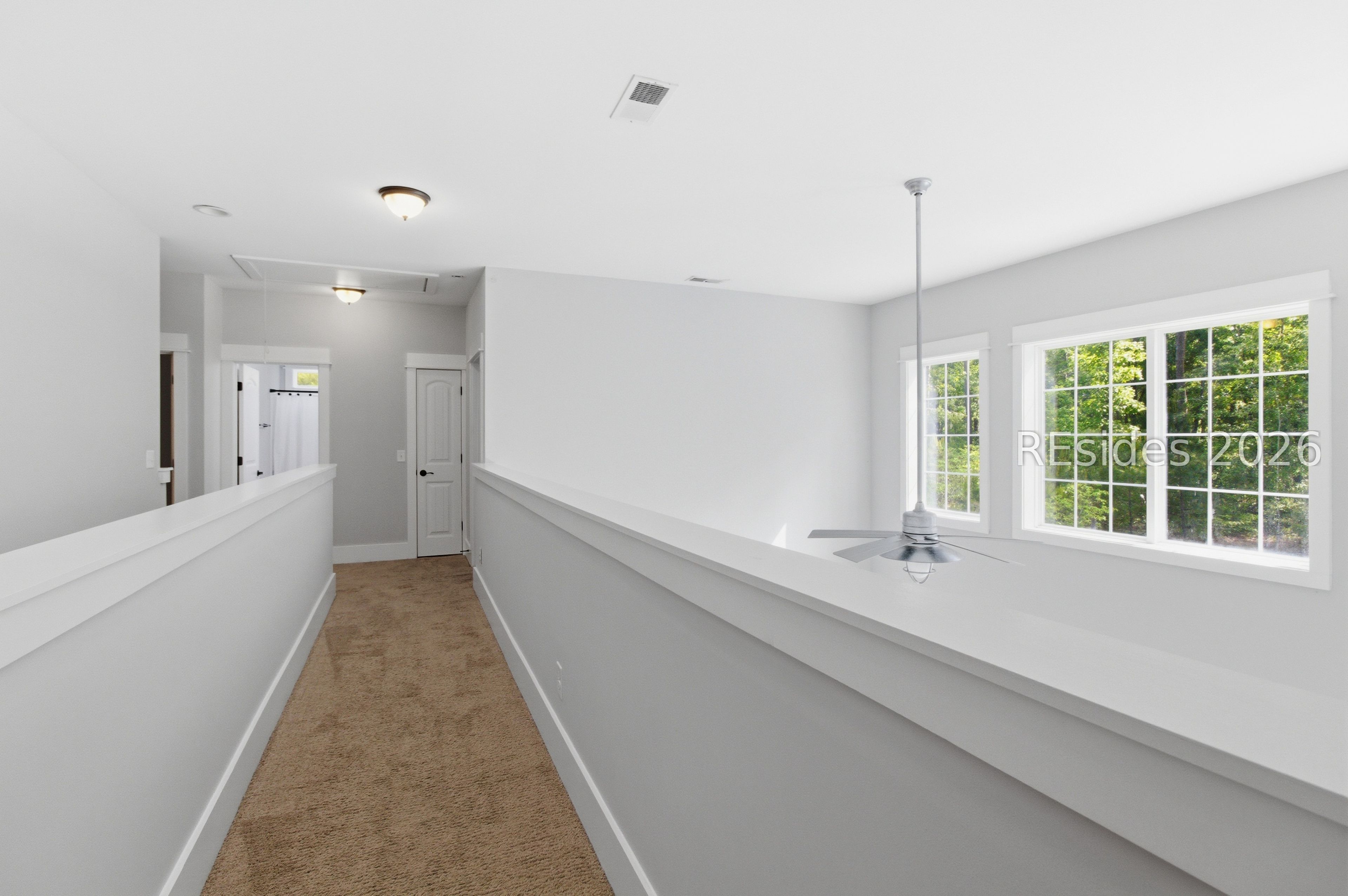 16 Dove Tree Lane Bluffton, SC 29910 - Photo 21 of 30 Galley walk with 5th bedroom on one side