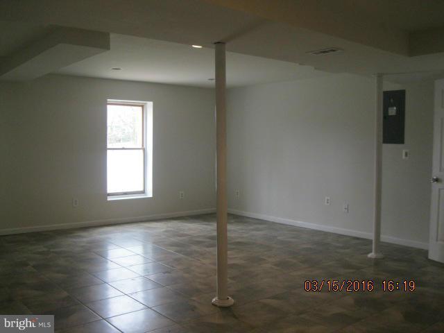 9239 Fowler Lane Lanham, MD 20706 - Photo 14 of 17 an empty room with wooden floor and windows