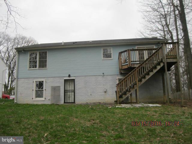 9239 Fowler Lane Lanham, MD 20706 - Photo 16 of 17 front view of a house with a yard