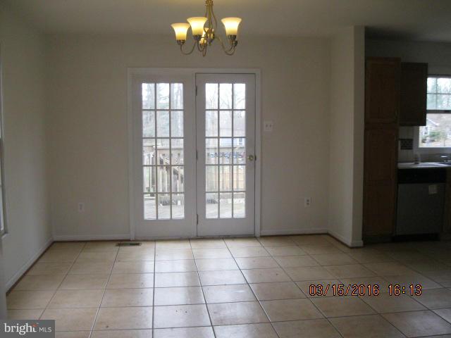 9239 Fowler Lane Lanham, MD 20706 - Photo 6 of 17 a view of an empty room with a window