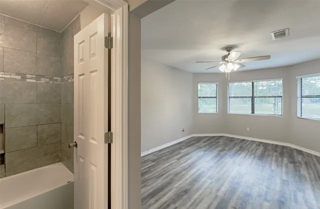 a view of an empty room with a window