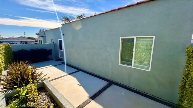 a spacious bathroom with a toilet sink and a mirror