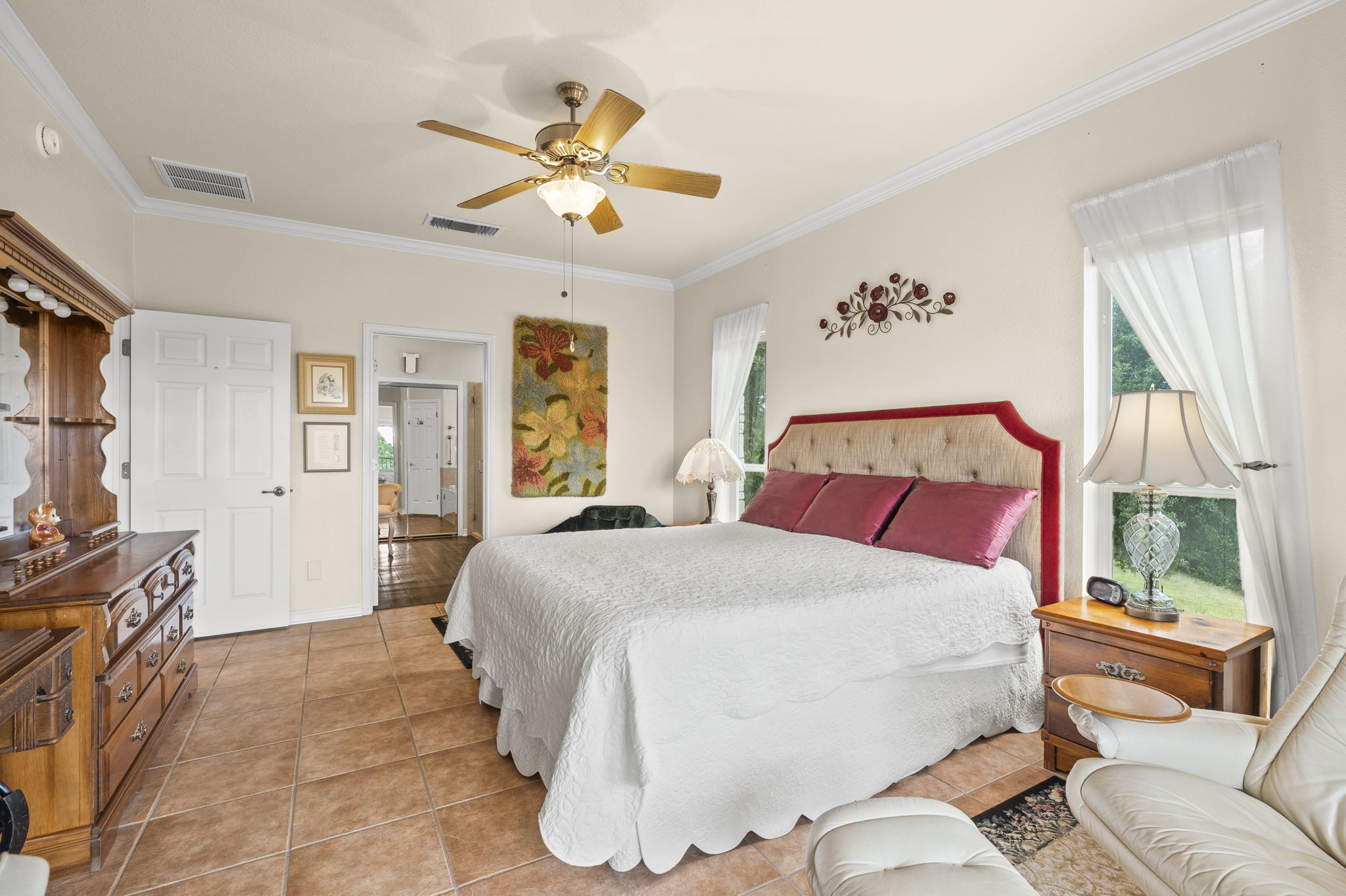1427 River Ridge Ranch Road Killeen, TX 76549 - Photo 17 of 40 Relax in this tranquil master bedroom, offering elegant crown molding and ample natural light.
