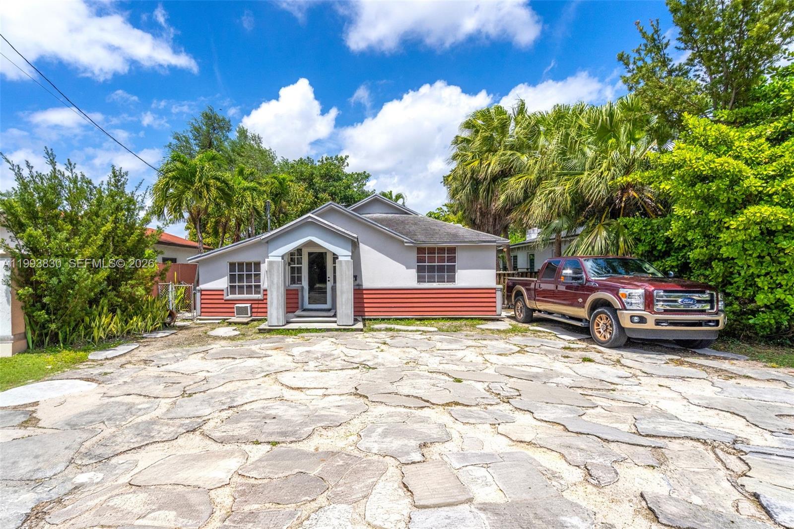 6295 Southwest 29th Street, Unit 1 Miami, FL 33155 - Photo 1 of 15 a view of a house with a patio