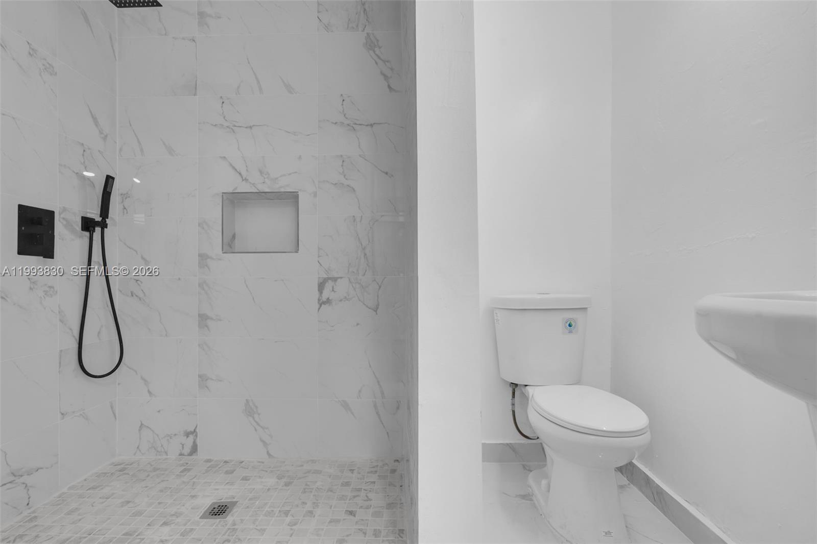 6295 Southwest 29th Street, Unit 1 Miami, FL 33155 - Photo 11 of 15 a bathroom with a toilet and a shower