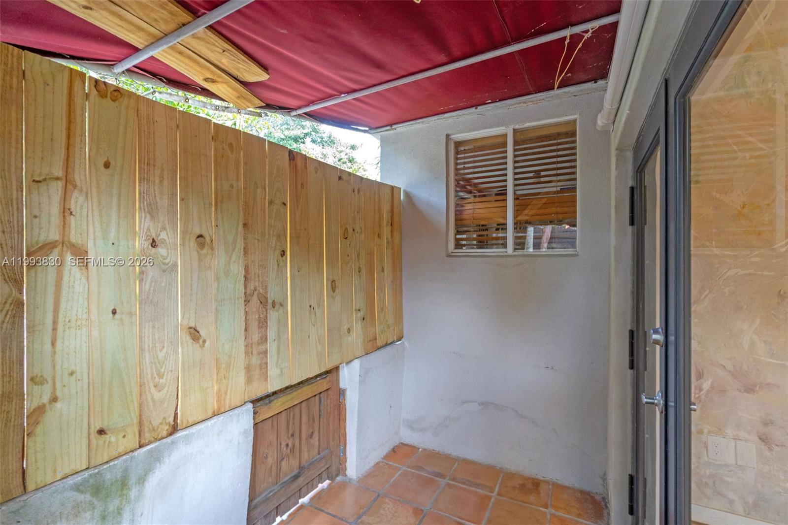 6295 Southwest 29th Street, Unit 1 Miami, FL 33155 - Photo 15 of 15 a view of a wooden door