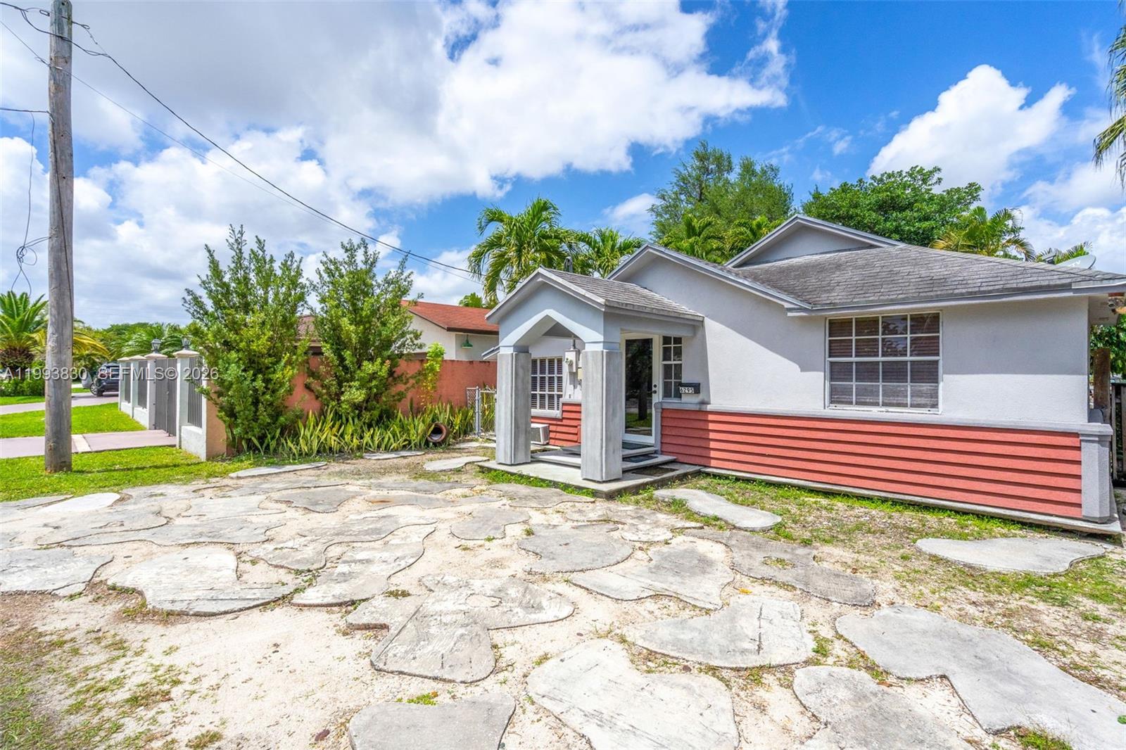 6295 Southwest 29th Street, Unit 1 Miami, FL 33155 - Photo 3 of 15 a front view of a house with a yard