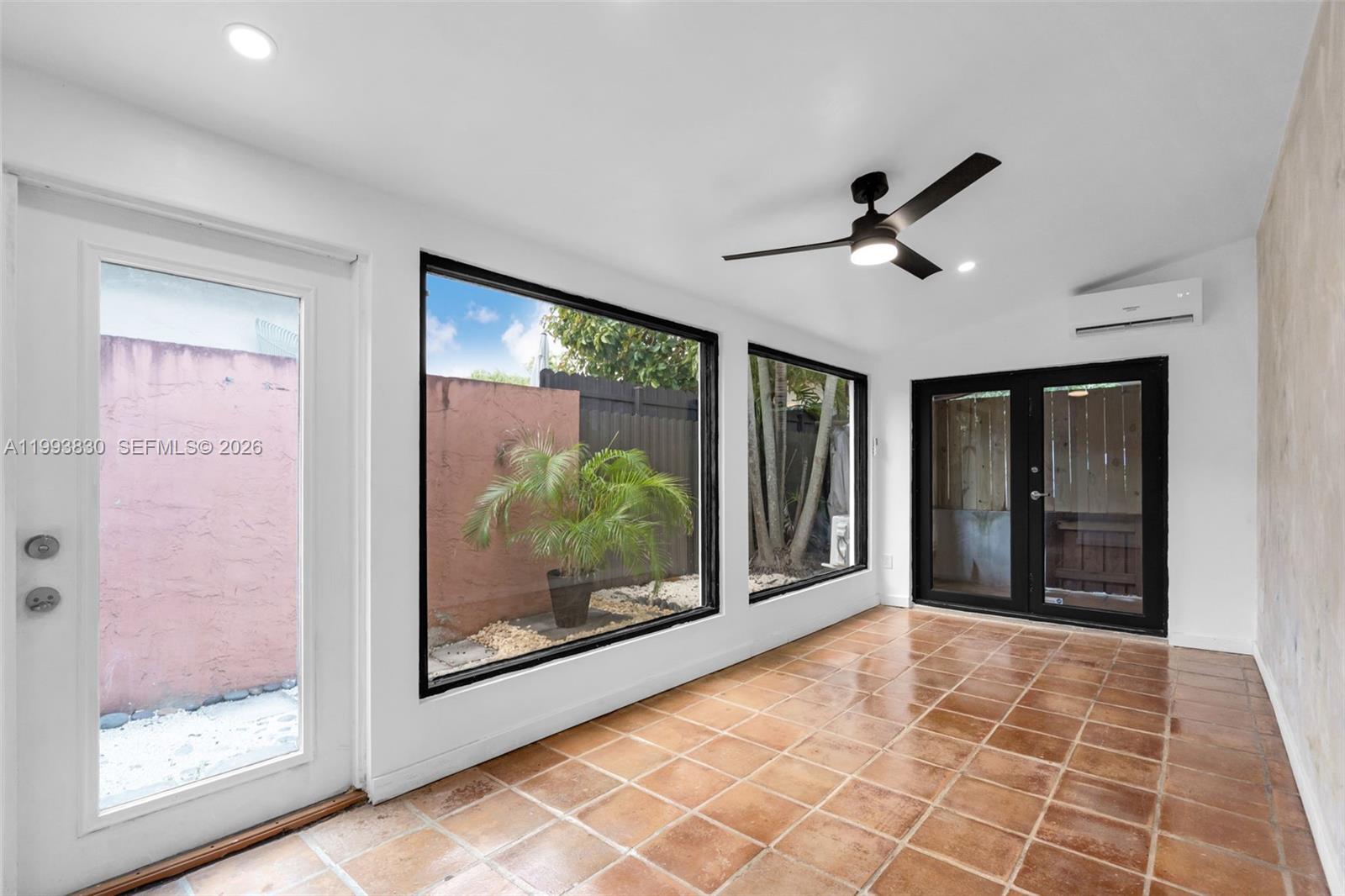 6295 Southwest 29th Street, Unit 1 Miami, FL 33155 - Photo 6 of 15 a view of empty room with front door