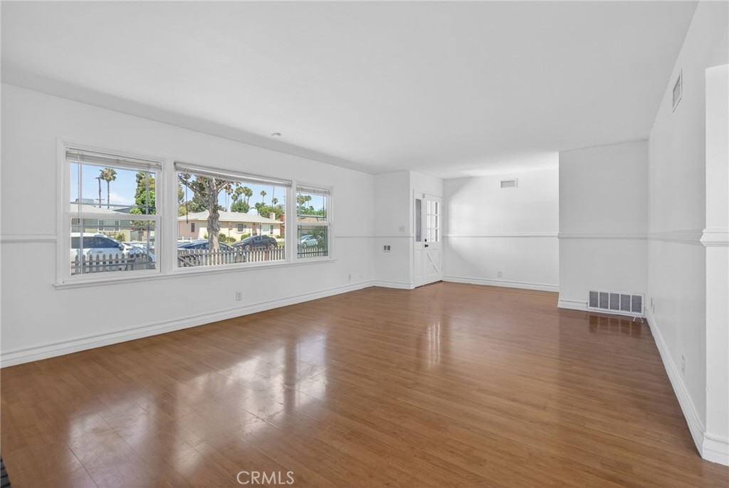 4194 Euclid Court Riverside, CA 92504 - Photo 5 of 29 Spacious living room with double pane windows and fireplace.