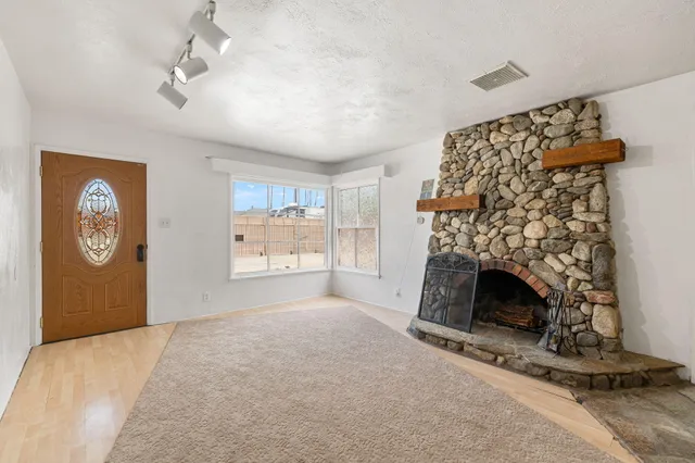 a bedroom with bed and a fireplace