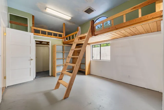 a view of an entryway with wooden stairs