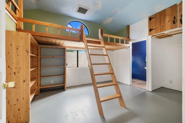 a view of an empty room with stairs