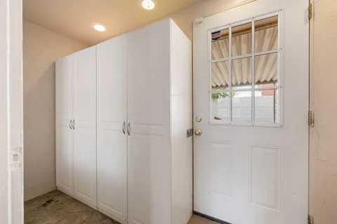 a view of a white house with a outdoor space