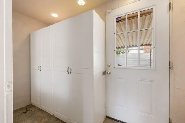 a view of a white house with a outdoor space